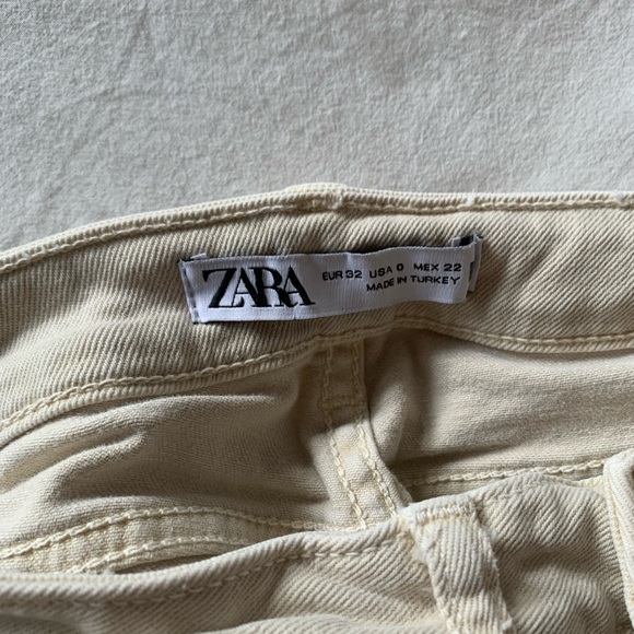 Zara cream colour flare jeans. Slit on interior of each size of flare pant. - Picture 2 of 3